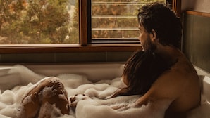 A couple in a bathtub filled with bubbles, with a window in the background. - Kangaroo Ridge Retreat (Healesville)