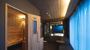 A modern bathroom with a wooden bench, a sink, and a large window. - LINNAS Kanazawa (Kanazawa)