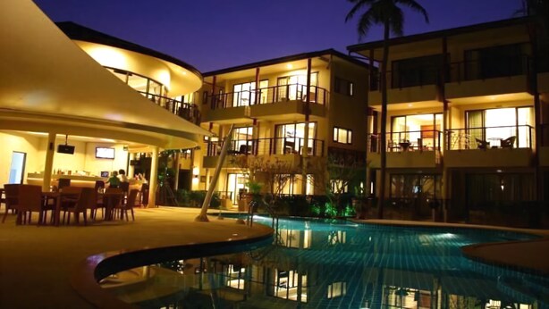 A hotel with a pool, multiple balconies, and a bar area. - TSE Residence by Samui Emerald Condominiums (Koh Samui)