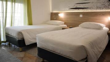 Double or Twin Room | Minibar, in-room safe, soundproofing, cots/infant beds