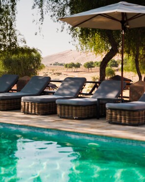 Outdoor pool, open 8 AM to 8 PM, free pool cabanas, pool loungers