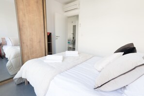 2 bedrooms, desk, blackout drapes, iron/ironing board