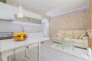 Apartment, 1 Bedroom, Terrace, Partial Sea View | Living room | Flat-screen TV