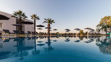 2 outdoor pools, open 11:00 AM to 8:00 PM, pool umbrellas, sun loungers