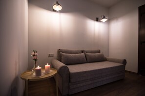 Family Quadruple Room (KALLIOPI) | Living area | 32-inch flat-screen TV with satellite channels, TV - Mythic Valley (Dio-Olympos)