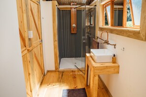 Shower, rainfall showerhead, towels, toilet paper
