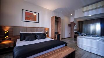 Elite Studio Suite, City View | In-room safe, desk, laptop workspace, iron/ironing board