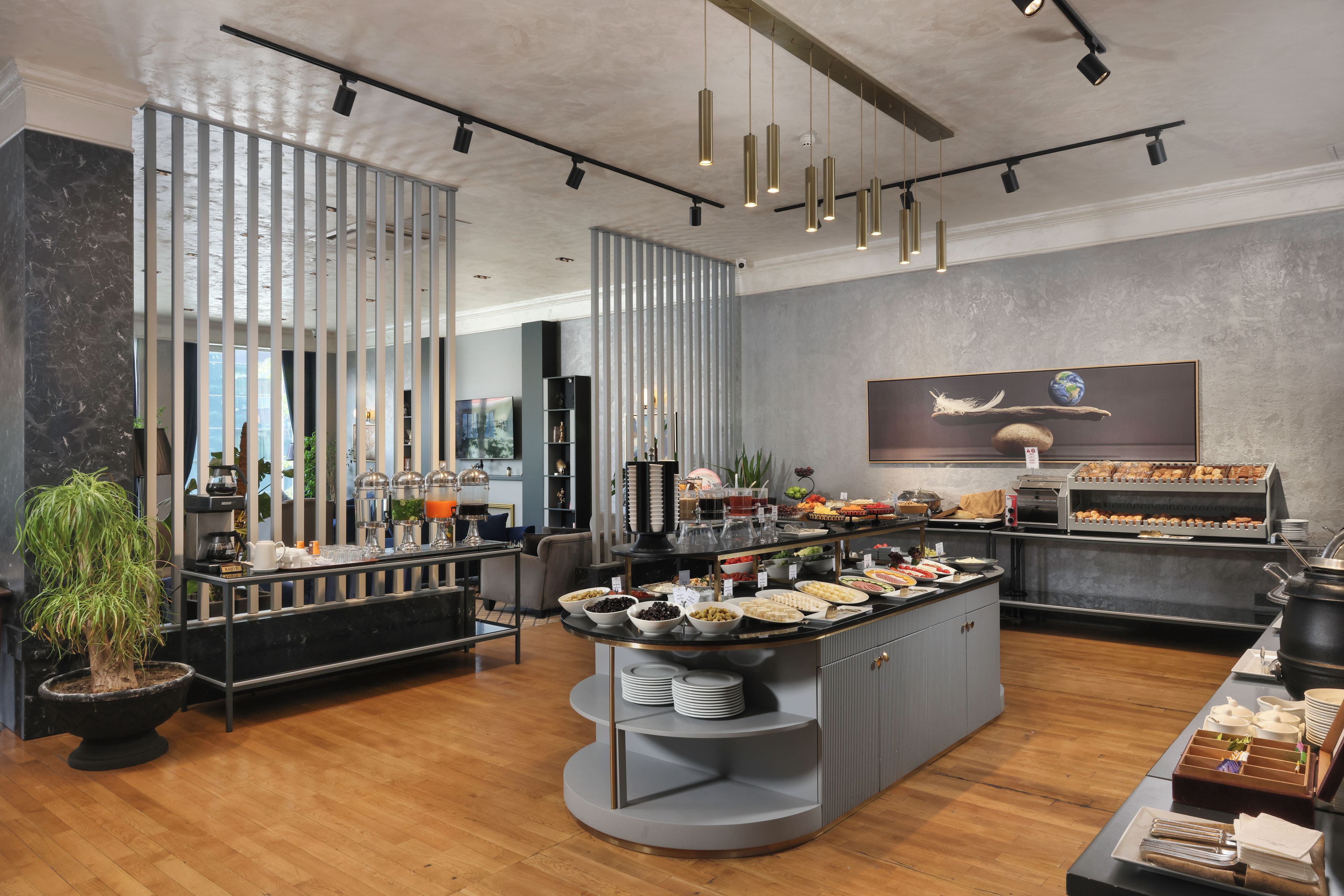 A modern buffet setup with a variety of food items and a central serving station.