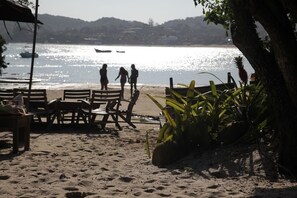 On the beach, sun-loungers, beach umbrellas