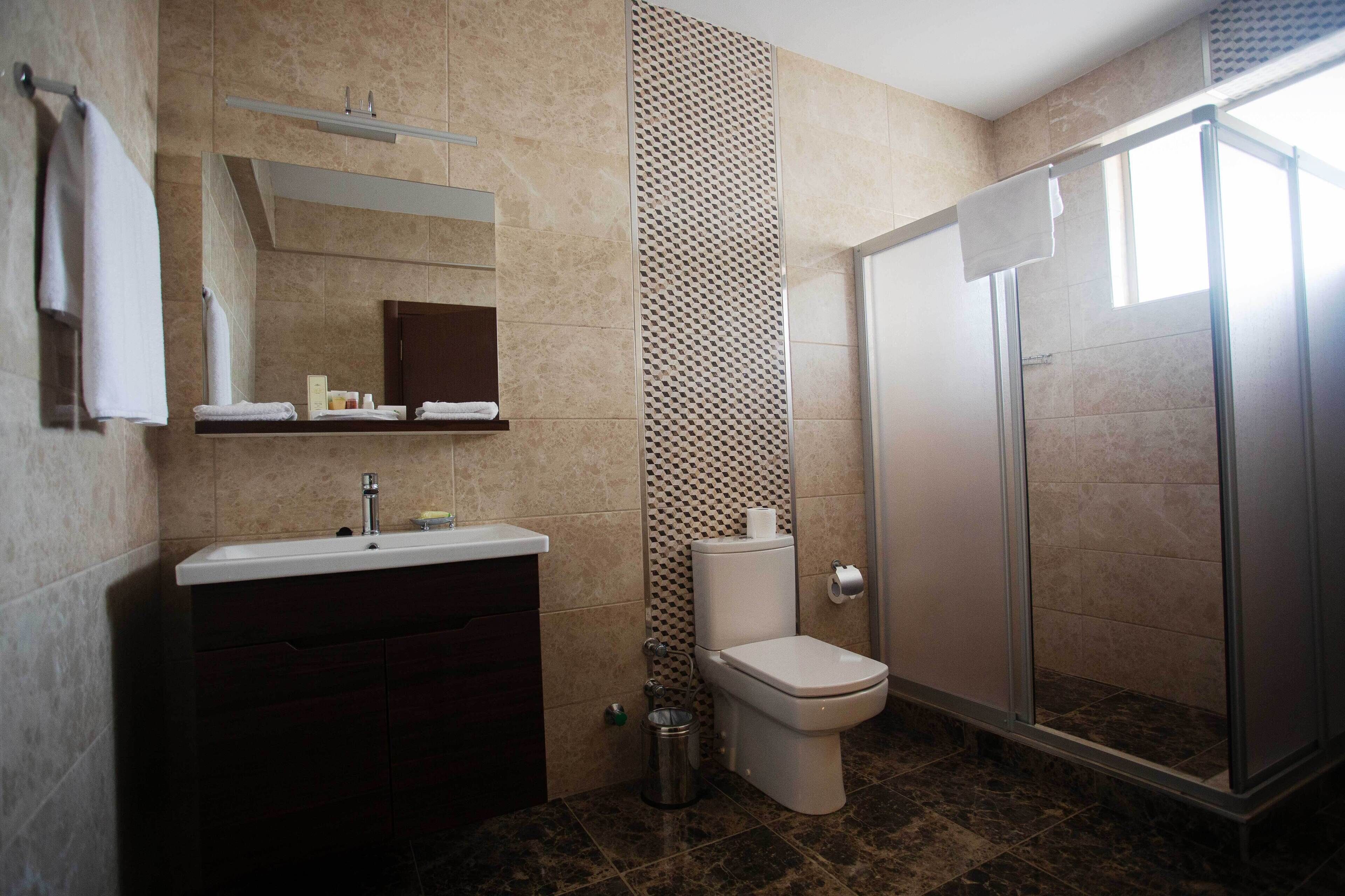 standard single room | bathroom | shower, free toiletries, towels, soap
