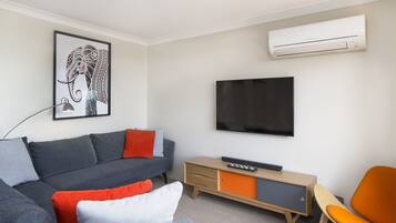 Apartment, 3 Bedrooms | Living room | Flat-screen TV, DVD player