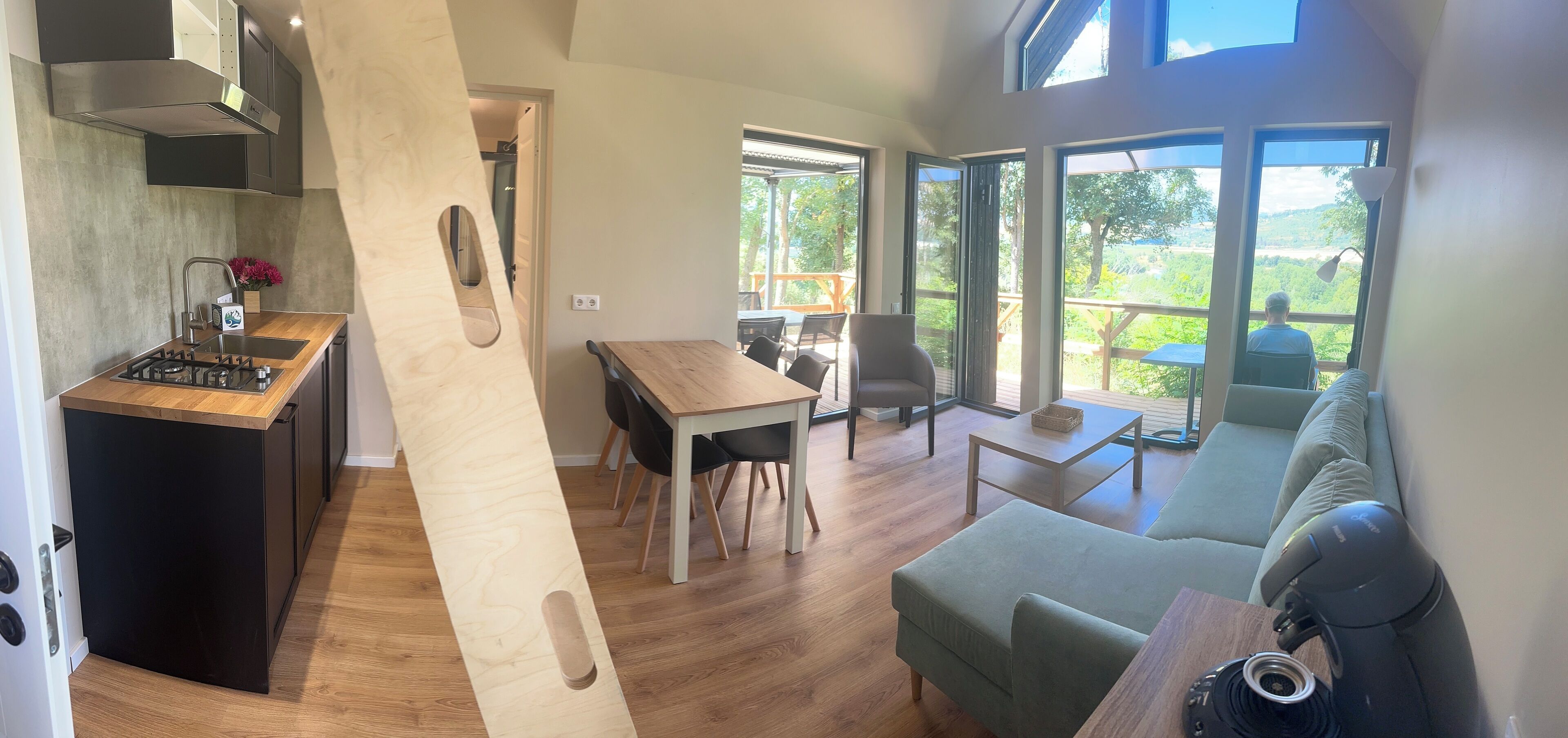 elite cottage, 1 queen bed, river view | living area | flat-screen tv, fireplace