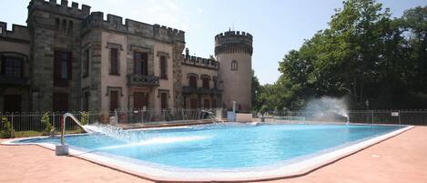 Seasonal outdoor pool, open 10:00 AM to 8:00 PM, pool umbrellas