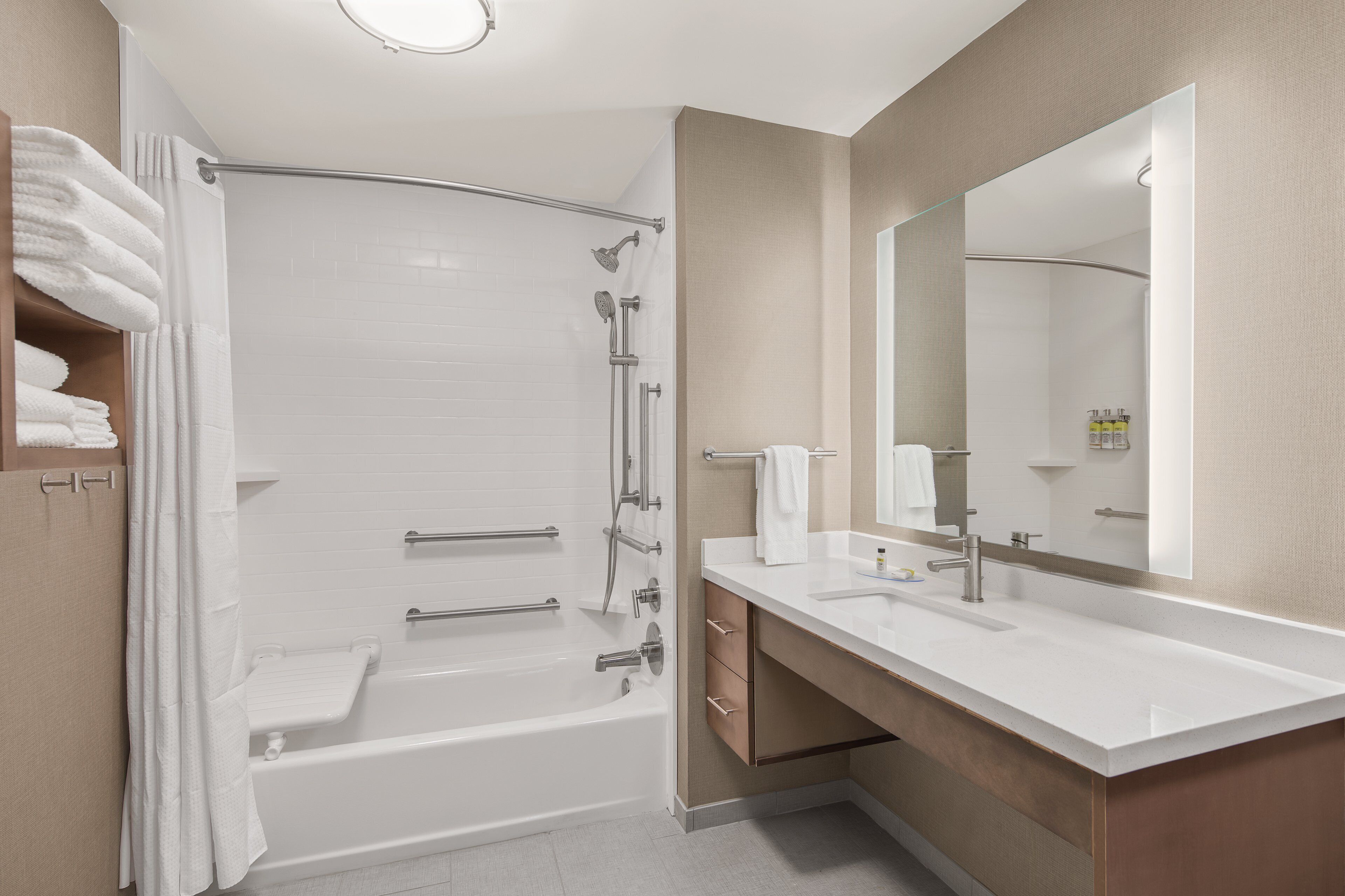 studio suite, 1 king bed, accessible, kitchen (mobility, accessible tub) | bathroom | designer toiletries, hair dryer, towels, soap