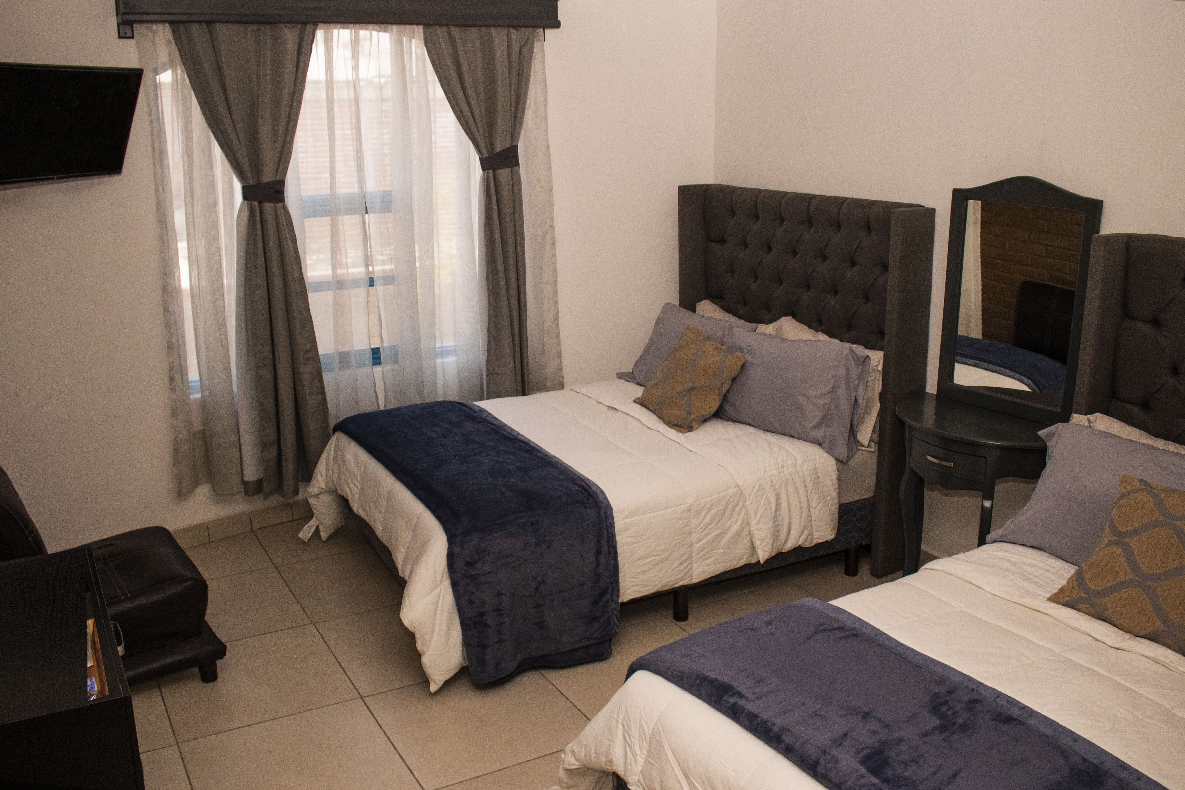 family quadruple room, 2 double beds | 1 bedroom, iron/ironing board, bed sheets