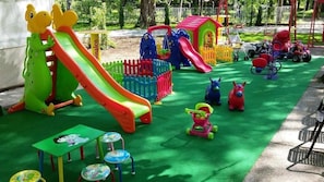 A children's play area with slides, a small house, and various play structures. - Hotel Camp Karagaq (Pec)