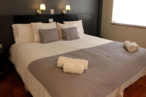 Classic Double Room | Minibar, in-room safe, desk, iron/ironing board
