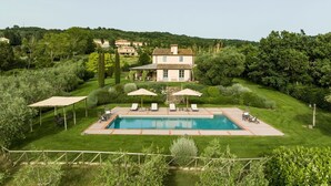 A large house with a swimming pool, surrounded by lush greenery and hills. - Villa Danilo - Luxury Holiday Villa with private swimming pool in San Casciano dei Bagni, Orcia ... (San Casciano Dei Bagni)