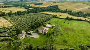 An aerial view of a countryside property with a large field, a swimming pool, and several buildings. - Villa Danilo - Luxury Holiday Villa with private swimming pool in San Casciano dei Bagni, Orcia ... (San Casciano Dei Bagni)