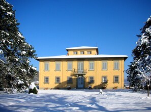 Traditional building with a central entrance and symmetrical facade.