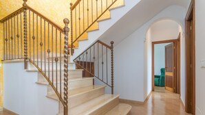 A staircase with wooden balusters and beige steps leading to a landing. - CA'N NADAL - ADULTS ONLY - Beautiful townhouse with great views. Free WiFi. (Sineu)