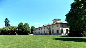 A large building with a symmetrical facade, multiple windows, and a central entrance.