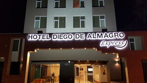 A hotel entrance with a sign reading "HOTEL DIEGO DE ALMAGRO Express".