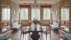 A grand room with a large ornate chandelier, a central table with chairs, and large windows with shutters. - Beautiful private villa with private pool, WIFI, A/C, TV, patio and panoramic view, close to Lucca (San Concordio Di Moriano)