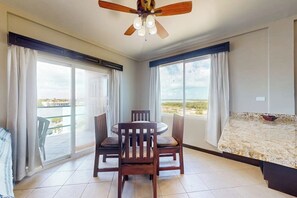 Dining - Tranquil lakefront condo with ocean views, shared pool, central AC & free WiFi! (San Pedro)