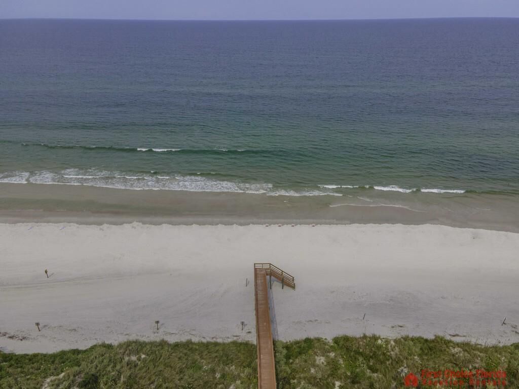A beach with a wooden boardwalk leading to the water. - Million Dollar Views ~ Heated Pool ~ King Bed (St Augustine)