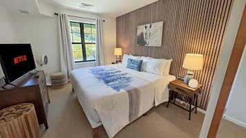 1 bedroom, desk, iron/ironing board, travel crib