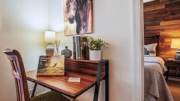 1 bedroom, desk, iron/ironing board, travel crib