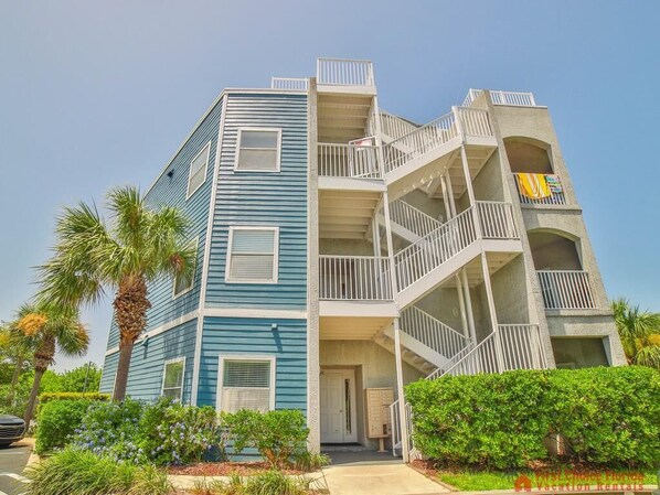 A multi-story building with balconies and a door at the ground level. - Oceanfront Resort ~ 3 Pools ~ Excellent Location (Saint Augustine)
