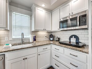 Fridge, microwave, coffee/tea maker, toaster