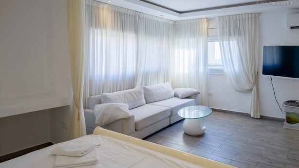 Family Studio Suite, 1 King Bed with Sofa bed, Partial Sea View | 3 bedrooms, desk, laptop workspace, iron/ironing board - Royal Lea Apartments (Netanya)