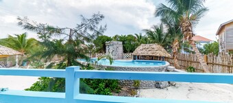 Island Paradise Suite with WiFi, Partial AC & Pool, Rooftop Patio & BBQ Area