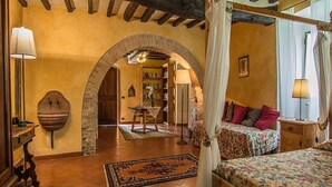 A bedroom with a canopy bed, a wooden dresser, a nightstand, and a bookshelf. - Private Villa with hot tub, private pool, A/C, WIFI, sauna, TV, patio, pets allowed, panoramic view (Grezzano)