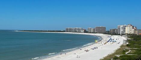 On the beach, sun-loungers