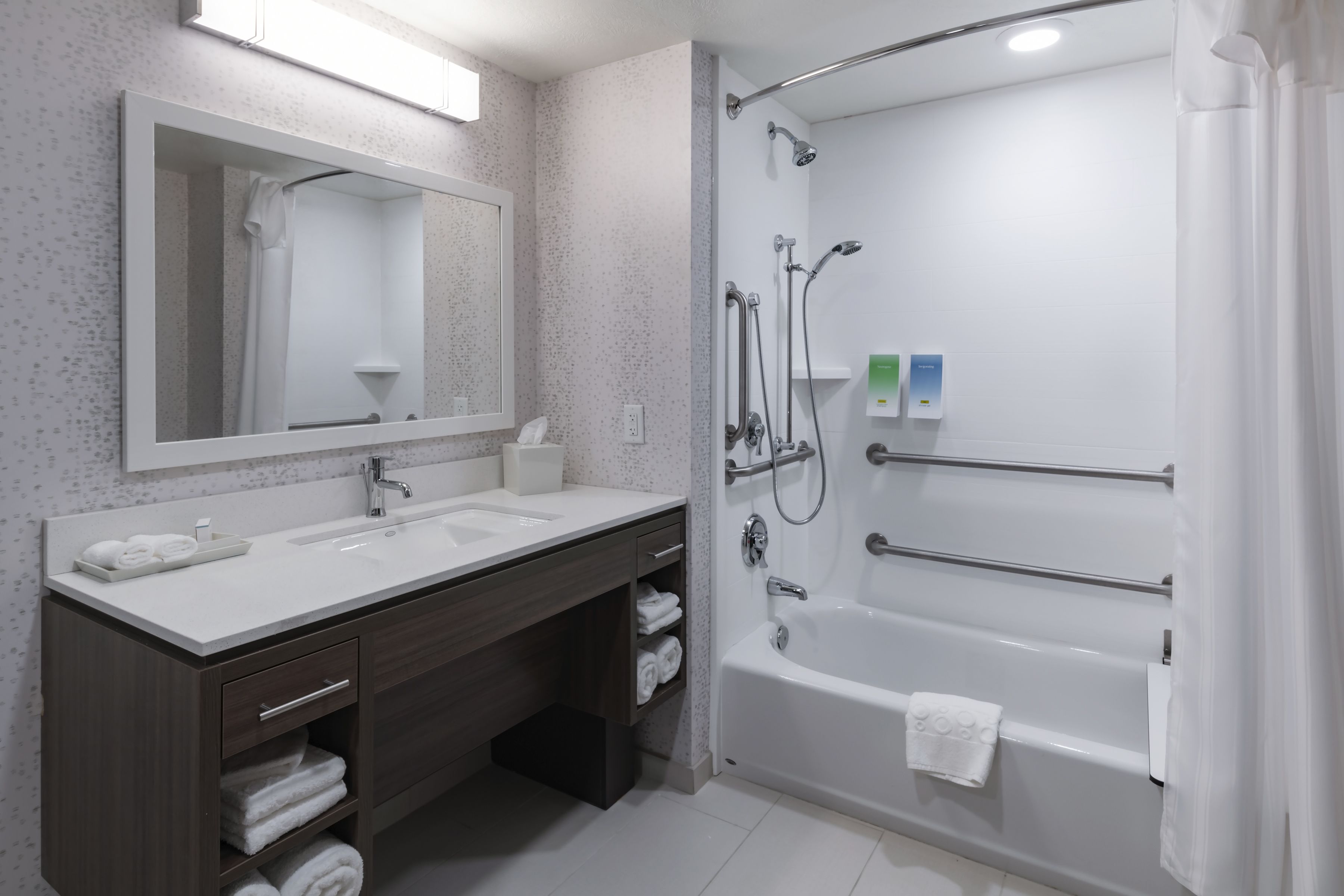 bathtub, free toiletries, hair dryer, towels