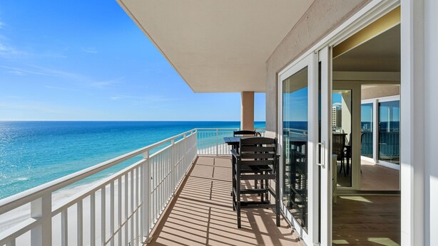 A balcony with a view of the ocean, a table, and chairs. - D1001 Direct Gulf-Front View, 3 Pools, Tennis (Panama City Beach)