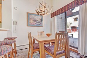 Enjoy meals in this dining area with a wooden table and six comfortable chairs.