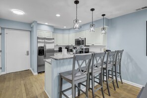 Fridge, microwave, oven, stovetop - 11E Mariners Walk by AvantStay | Ocean Views | Beachfront Living | Shared Pool (Isle Of Palms)