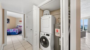 A hotel room with a washing machine, a dryer, and a view of the ocean. - E804 Balcony overlooks the beach! 3 Pools (Panama City)