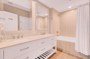 Combined shower/tub, hair dryer, towels, soap