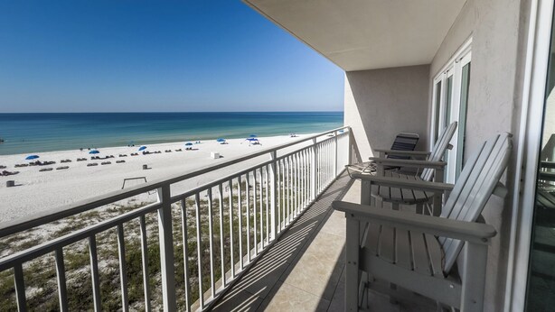 A balcony with a view of a beach and ocean. - D303 Low Floor, Direct Gulf View, 3 pools (Panama City Beach)
