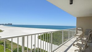 A balcony with a view of a beach and ocean. - South Seas T3-1509: Beautifully Updated Condo;  What a View! (Marco Island)