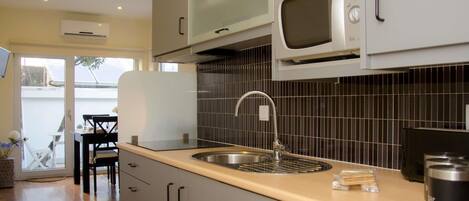 Fridge, microwave, coffee/tea maker, toaster