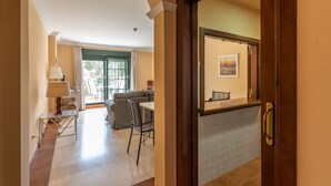 A hotel lobby with a dining area, a reception desk, and a view of the outdoors. - Prado Golf - Isla Canela Golf GPHG45P86 (Isla Canela)