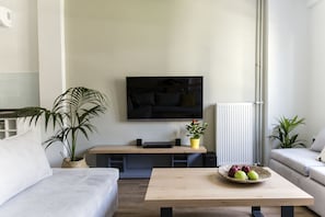 Deluxe-huoneisto, 4 makuuhuonetta, parveke, kaupunkinäköala | Olohuone