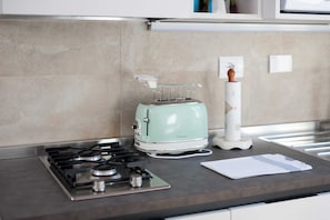 Departamento, 1 habitación | Cocina privada | Refrigerador con congelador, microondas, horno y parrilla de estufa